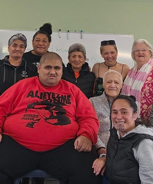 Members and whānau gathered together indoors